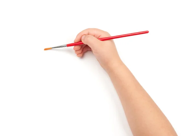 Paintbrush in child hand — Stock Photo, Image