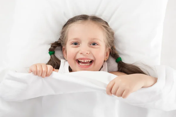 Cheerful girl in bed — Stock Photo, Image