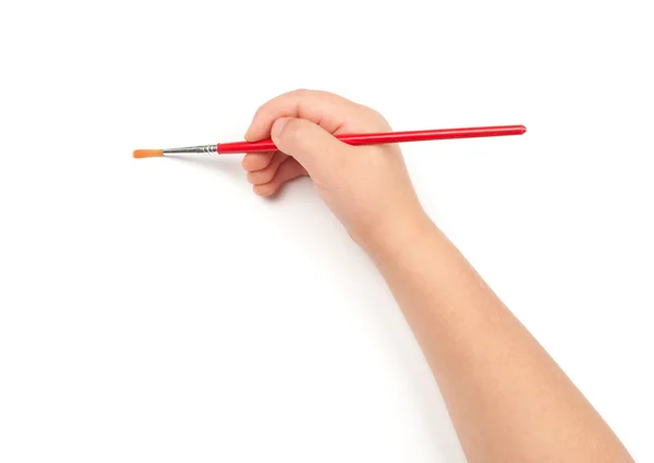 Paintbrush in child hand — Stock Photo, Image