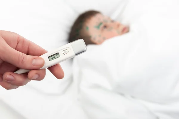 Sick boy and thermometer with high temperature — Stock Photo, Image