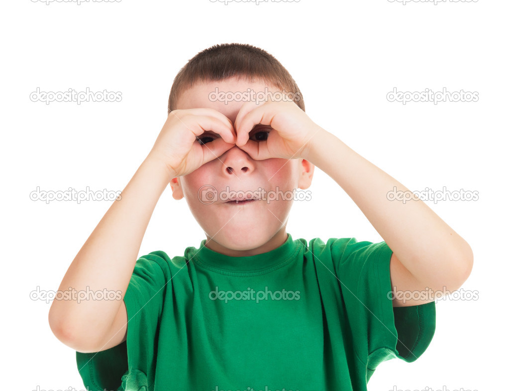 boy looks through his hands like binoculars