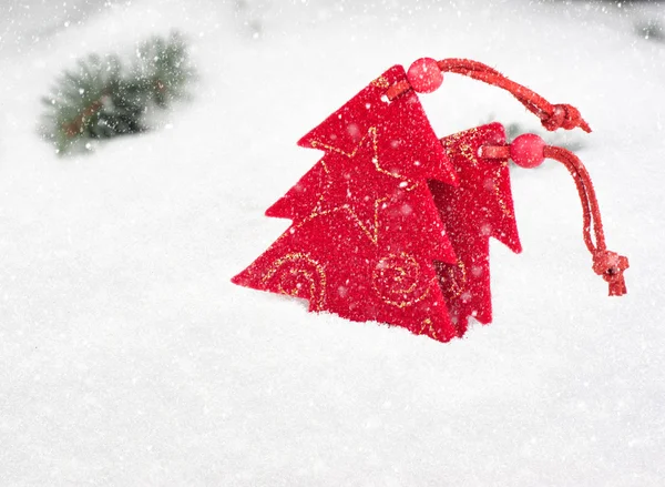 Christmas tree toy in snowfall — Stock Photo, Image