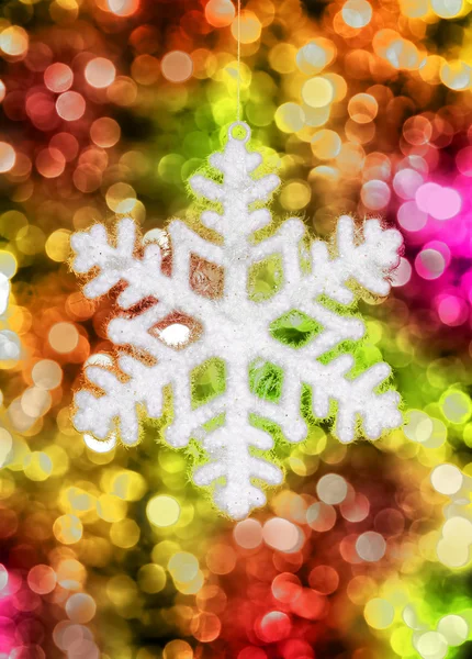 Big snowflake toy on colorful background — Stock Photo, Image