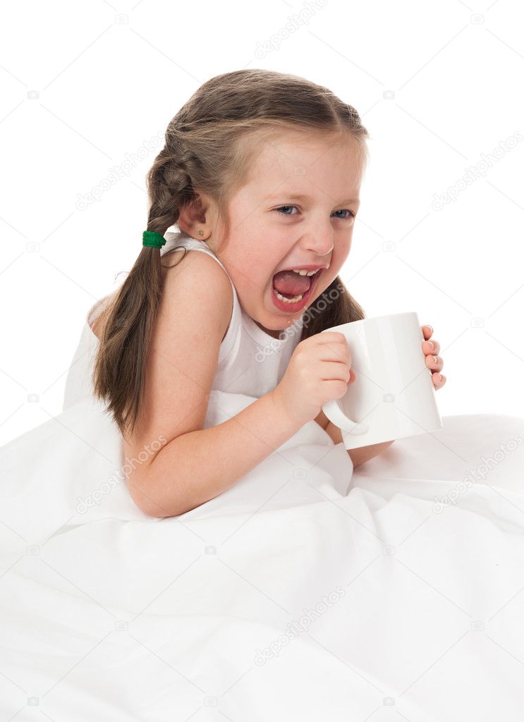 girl with cup in bed