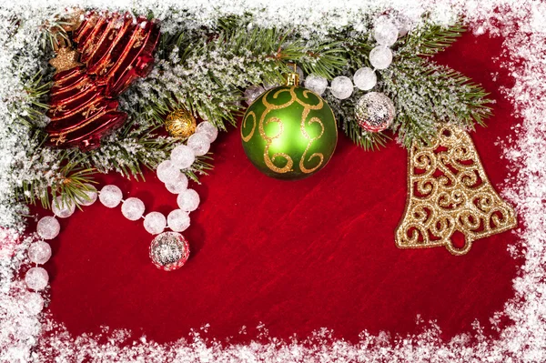 Christmas decoration on red — Stock Photo, Image