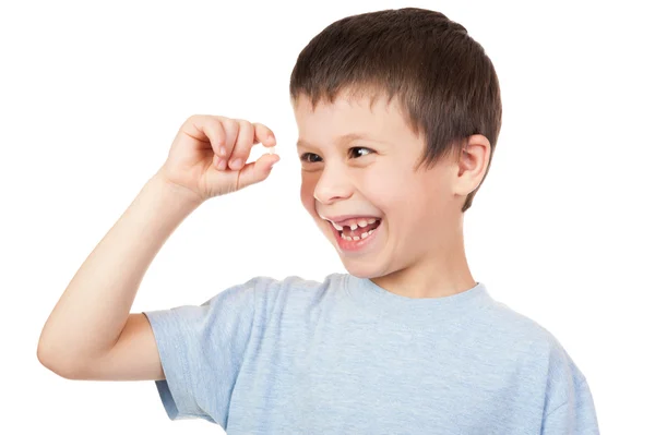 Boy looks at lost tooth — Stock Photo, Image