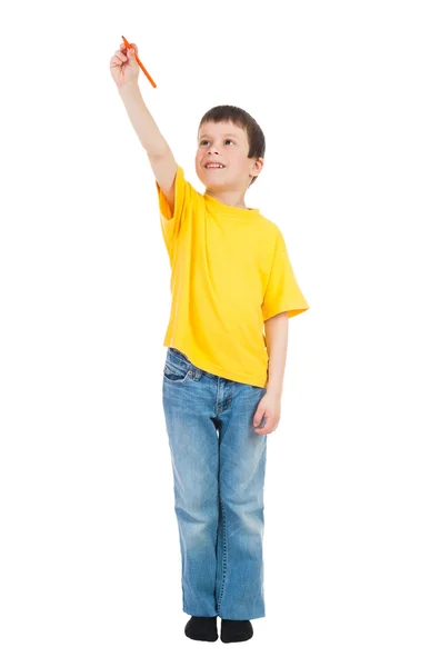 Boy in yellow shirt writes marker — Stock Photo, Image