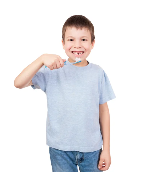 Boy portrait with toothbrush and lost tooth — Stock Photo, Image