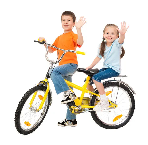 Menino e menina na bicicleta isolado — Fotografia de Stock