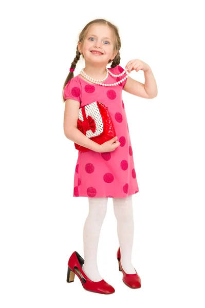 Dziewczynka w czerwonej sukience na biały — Zdjęcie stockowe