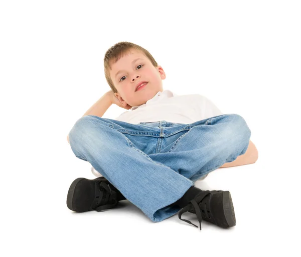 Boy lay on your back on white — Stock Photo, Image