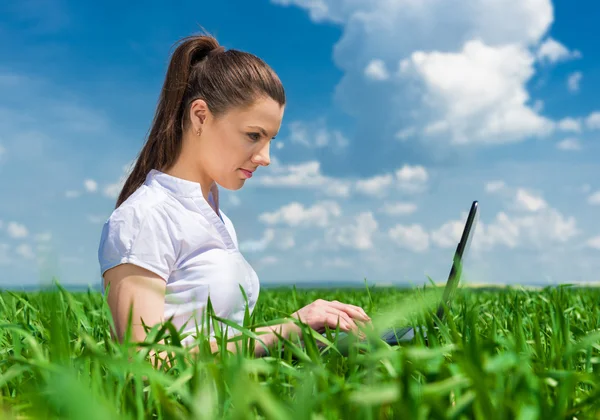 Girl with notebook on field — Stock Photo, Image