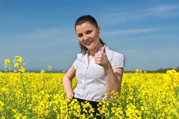 Girl on yellow flower field — Stock Photo, Image