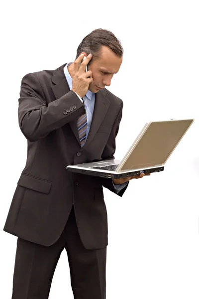 Affärsman telefon och laptop — Stockfoto