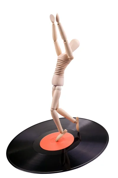 Mannequin dancing on vinyl disc — Stock Photo, Image