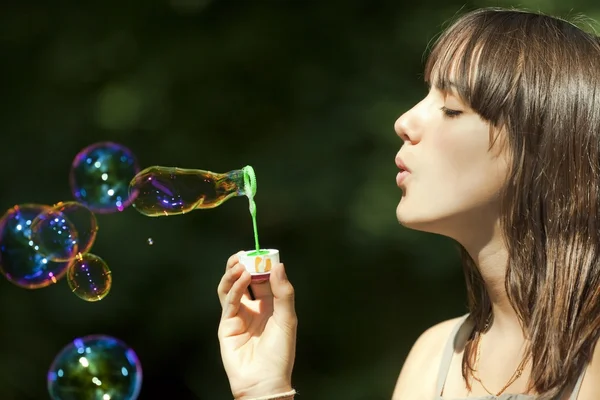 Teen blowing bubbles — Stock Photo, Image