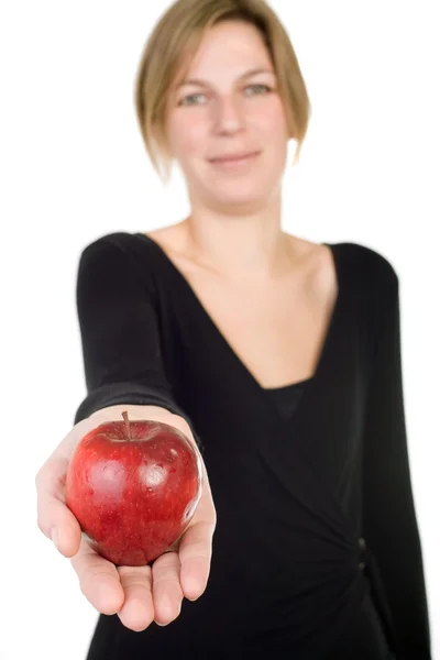 Woman presenting apple Stock Picture