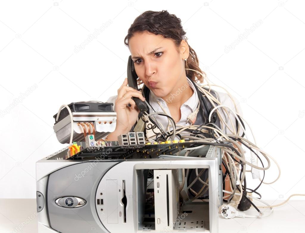 Young business woman calling technology support for the broken computer