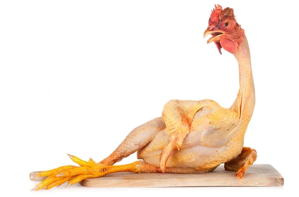 Raw chicken on cutting board — Stock Photo, Image