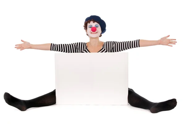 Cheerful clown woman seated on floor — Stock Photo, Image