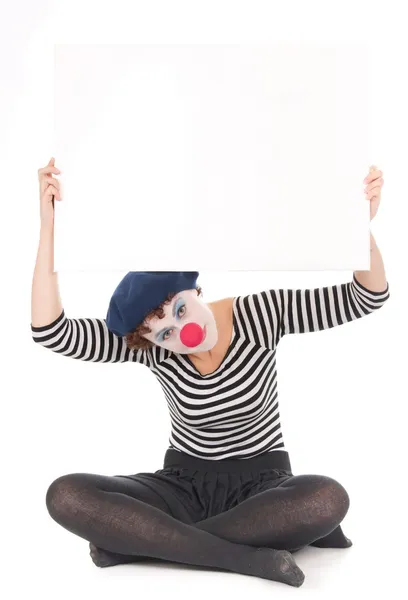 Pretty clown woman holding blank billboard isolated on white background — Stock Photo, Image