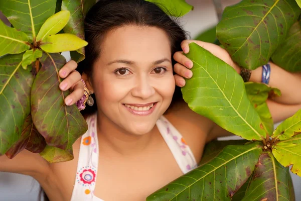 Woman in leaves — Stock Photo, Image