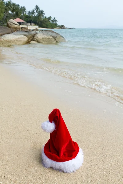 Santa caus hat on beach Royalty Free Stock Photos