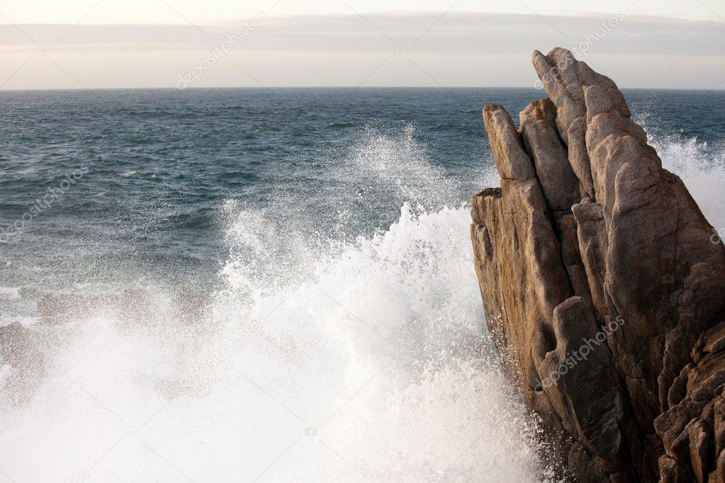 wave splashing on rock