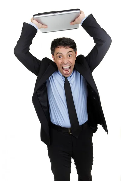 Rozzlobený podnikatel házení jeho laptop — Stock fotografie