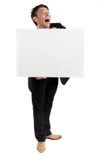 Affärsman som innehar ett tomt vitt kort — Stockfoto
