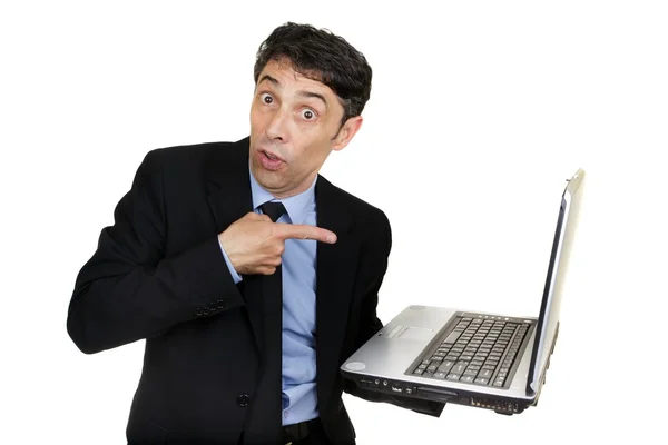 Homem de negócios apontando para seu laptop — Fotografia de Stock