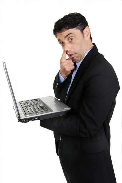 Businessman with his finger to his nose — Stock Photo, Image
