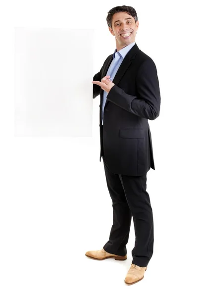 Man with a cheesy grin holding a blank sign — Stock Photo, Image