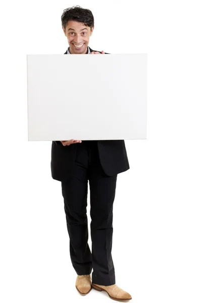 Hombre persuasivo con una gran sonrisa y una señal en blanco — Foto de Stock