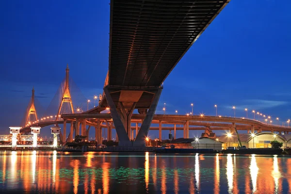 Bhumibol Bridge across river with light trail at twilight — Stock Photo, Image