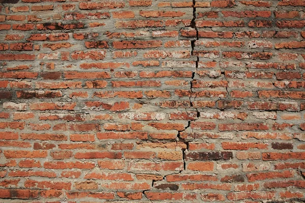 Textura da parede de tijolo rachado — Fotografia de Stock