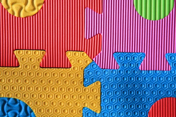 Barevné puzzle pěnové textura — Stock fotografie