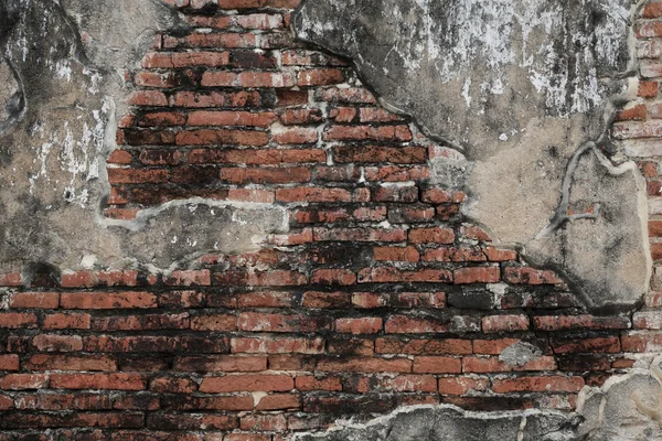 Parede de tijolo resistido e fragmento de cimento — Fotografia de Stock