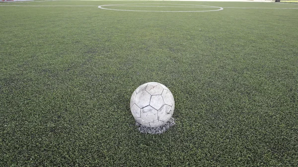 Old ball on new ground — Stock Photo, Image