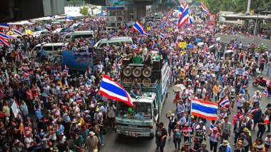 Thai protestors marching in Bangkok clipart