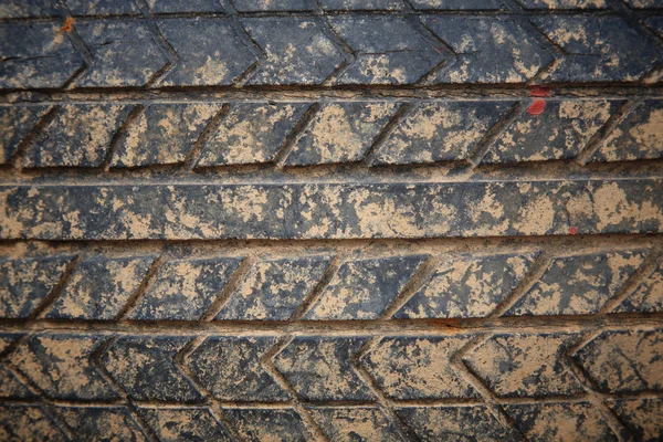 Grunge crack car tire with laterite dirt — Stock Photo, Image