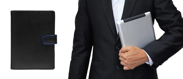 Business man holding tablet vs. organizer book isolated — Stock Photo, Image