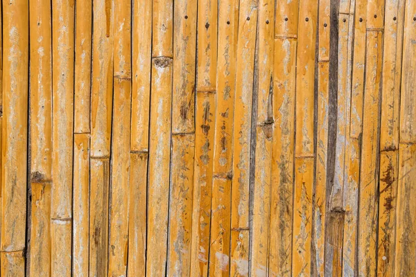 古い黄色の木製のリード壁フェンスパターンの背景 — ストック写真