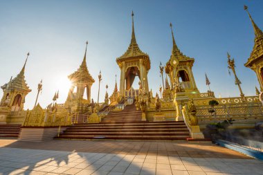 Golden Royal Cremation against sunbeam of His Majesty, The Late King Bhumibol Adulyadej, Rama 9, In Remembrance during sunset at Sanam Luang, Bangkok, Thailand