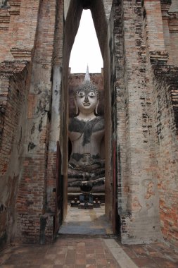 Big Buddha statue in temple at Wat Sri Chum in Sukhothai, Thailand. Here, Found in 1930, has large Buddha statue in mondop called Phra Atchana.
