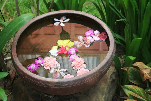 floating flower florals in water basin decorated in garden