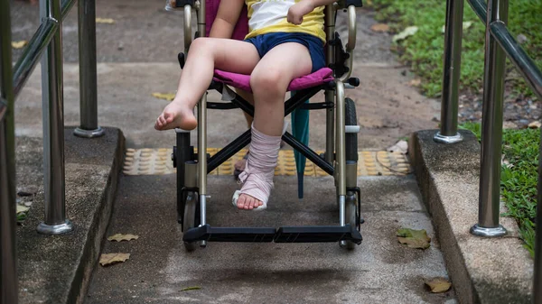 Patient Boy Sit Wheelchair Give Walk Handicapped Slope Footpath Park — Fotografia de Stock