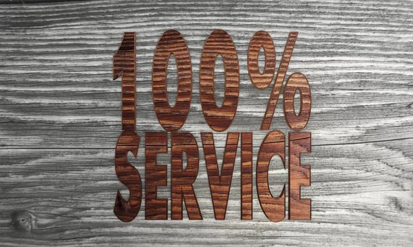 100 відсотків символу служби на новому дерев'яному фоні — стокове фото