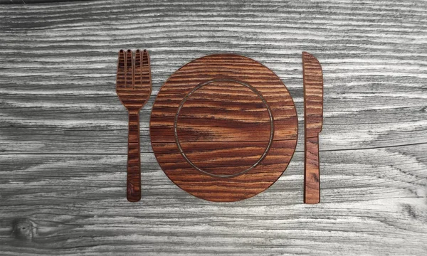 Elegante símbolo de restaurante en un fondo de madera —  Fotos de Stock