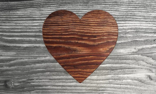 Sustainable heart symbol in a wooden background — Stock Photo, Image